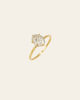 The All of Me Band by CAMELLIA is a gorgeous gold ring with an oval diamond set on a light background, crafted from hypoallergenic materials for optimal comfort.